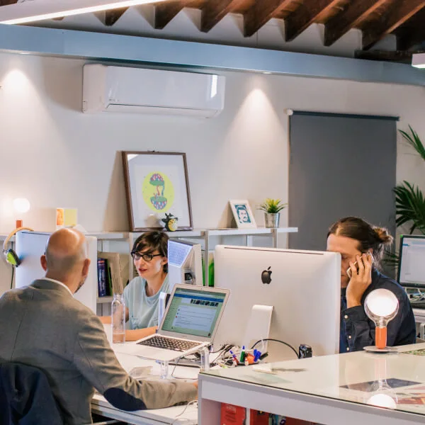 care-leaver-london-team-smiling-at-desk-man-woman-computers